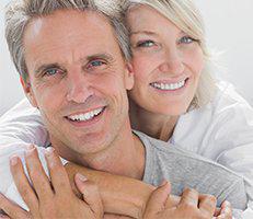 A man and woman smiling for the camera.